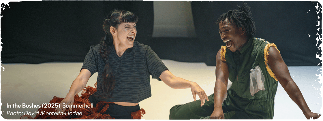 Two Fringe performers sit and laugh onstage. Credit text: 'In the Bushes (2025), Summerhall. Photo: David Monteith-Hodge.'